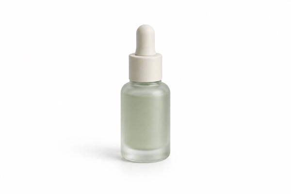 A full-size serum bottle in the example skincare bundle.